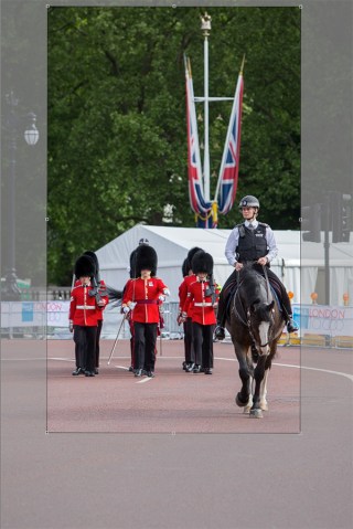 ©Neil Turner/Bupa 10,000. May 2015. A Police rider accompanies a detachments of Guards as they march back their barracks.