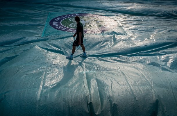 Getting Court 19 ready in the morning. The Championships 2015 at The All England Lawn Tennis Club. 04 July 2015. Neil Turner